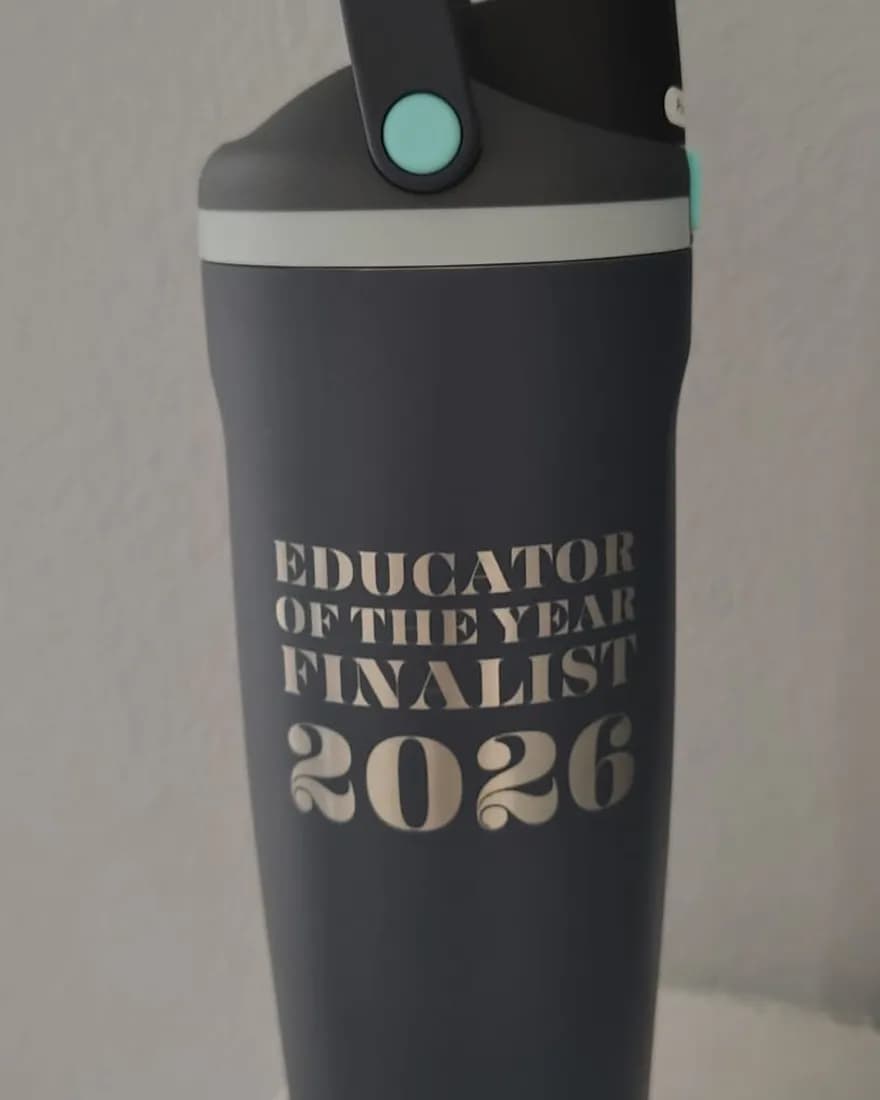 Dark grey tumbler laser-engraved with Educator of the Year Finalist 2026