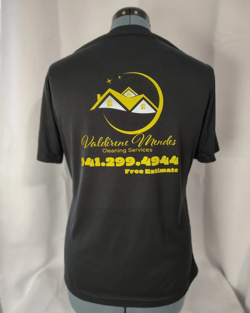 Black tee with a gold Valdirene Mendes Cleaning Services logo on the back