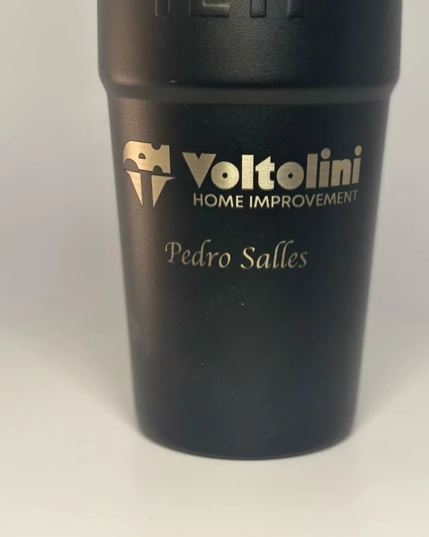 Black tumbler laser-engraved with the Voltolini Home Improvement logo and a name
