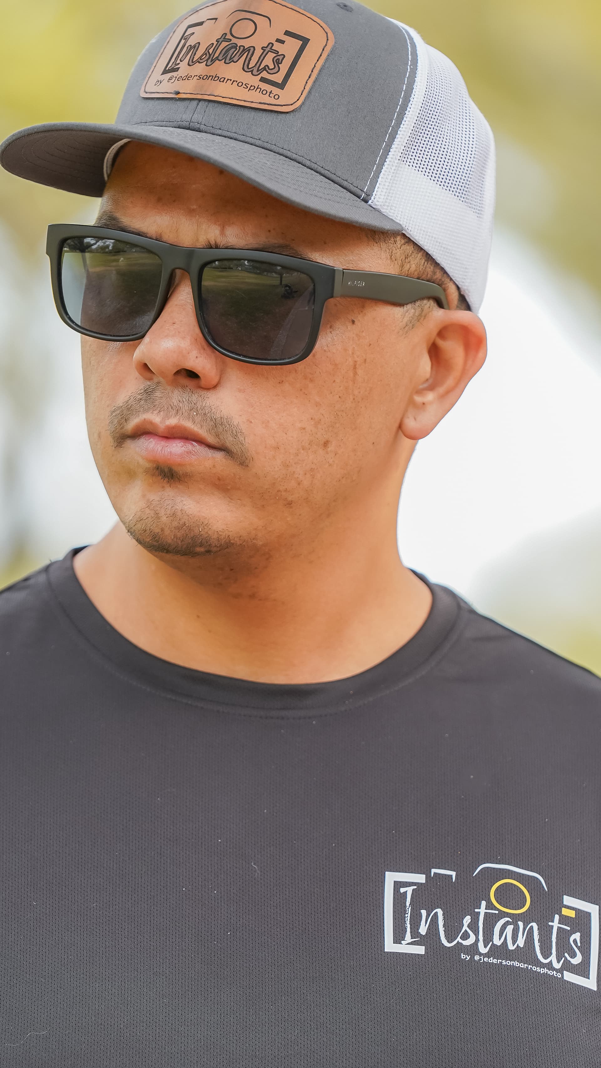 Trucker hat with a laser-engraved leather patch and a custom printed tee